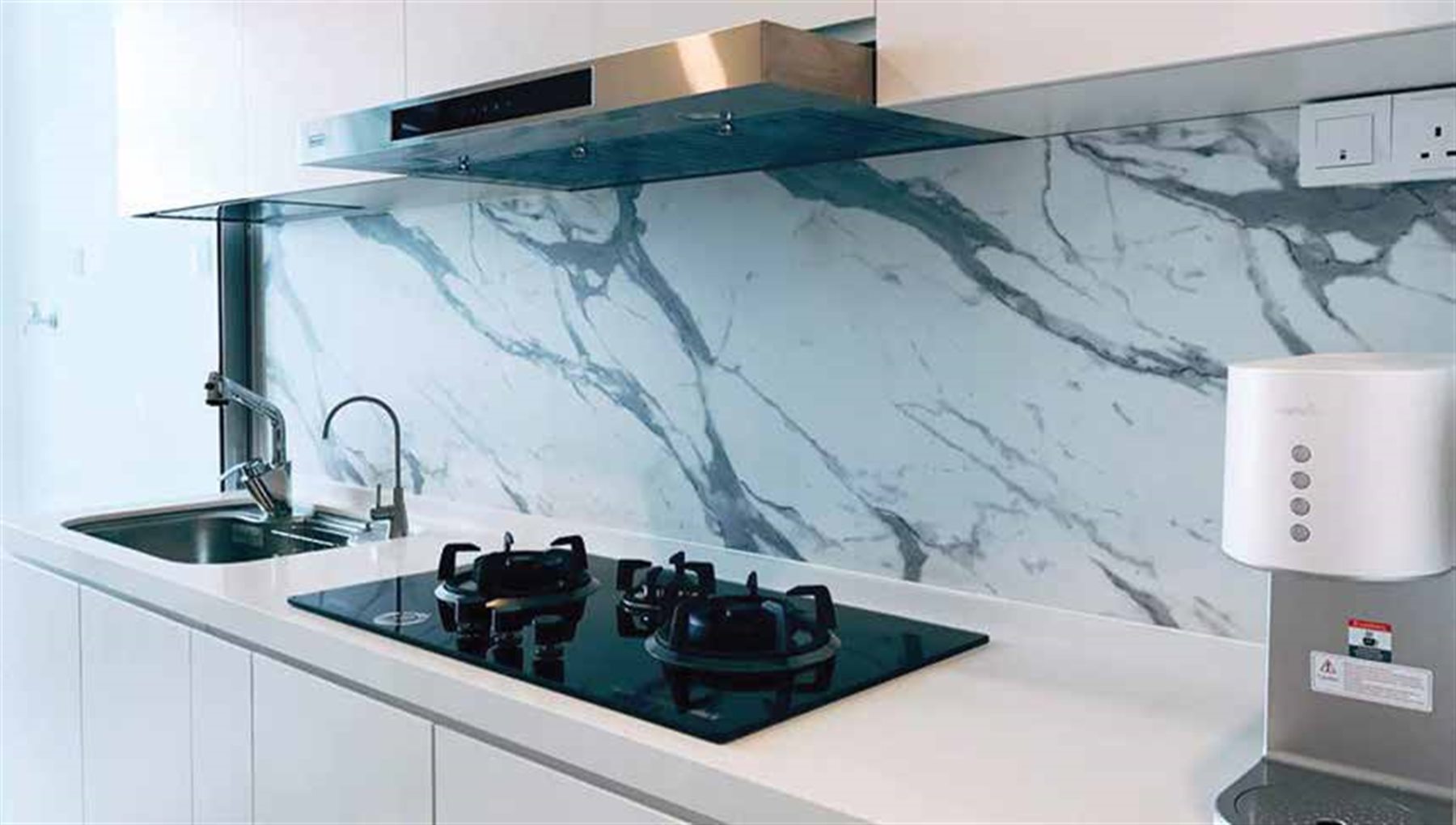 Kitchen with a marble design phenolic top and splashback